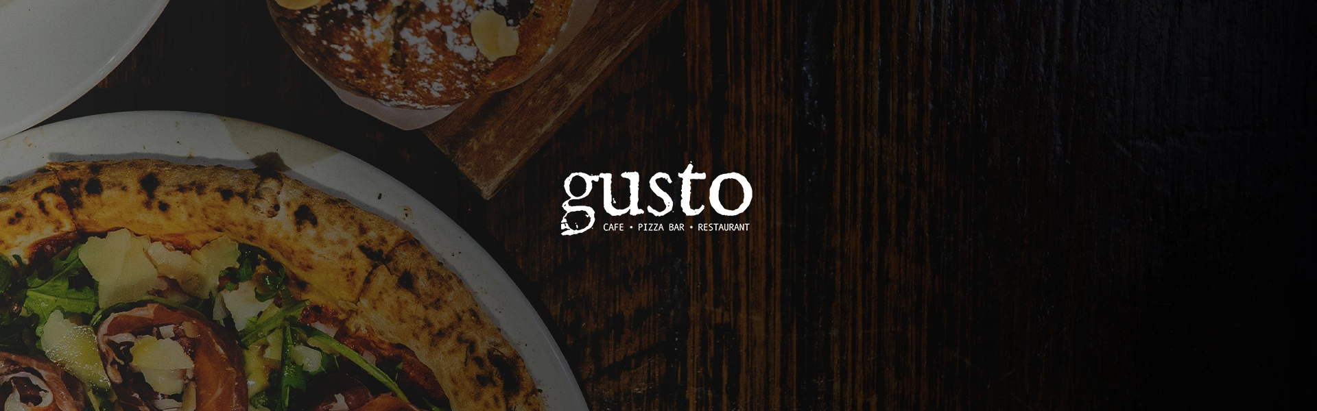 Gusto logo over a dark wooden table with wood-fired pizza and a pastry